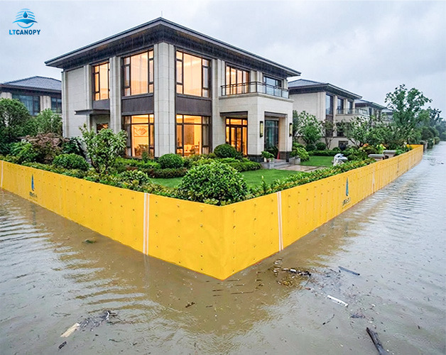 Fence-type flood barriers protect a house from floodwater during floods